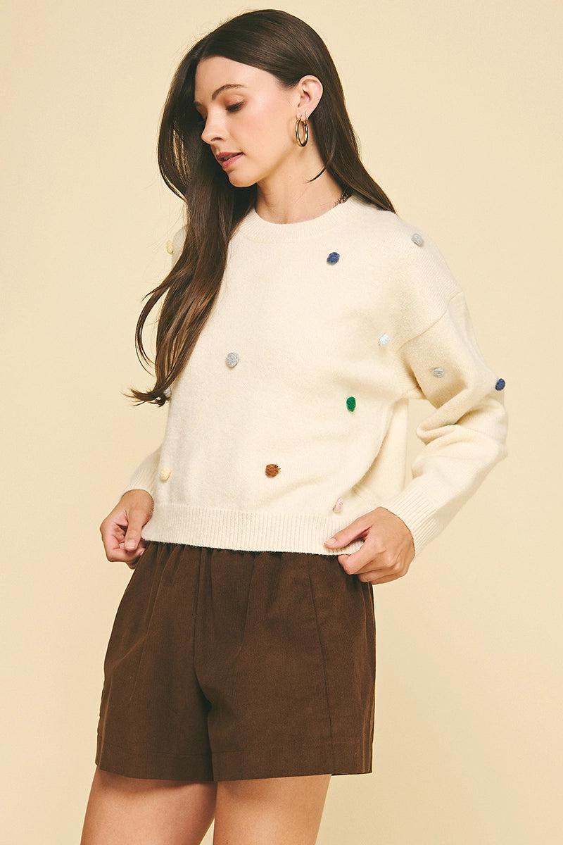 EMBROIDERED KNIT SWEATER