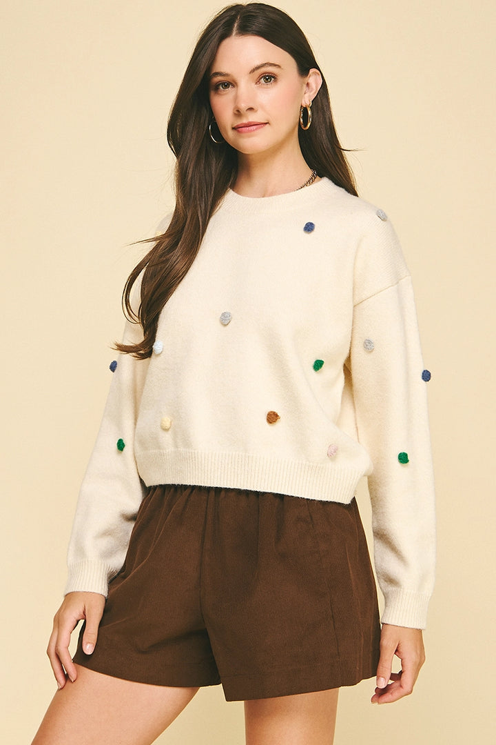EMBROIDERED KNIT SWEATER