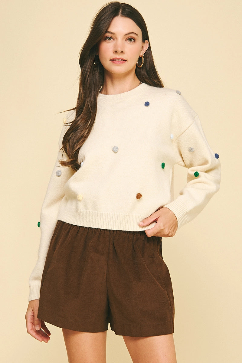 EMBROIDERED KNIT SWEATER
